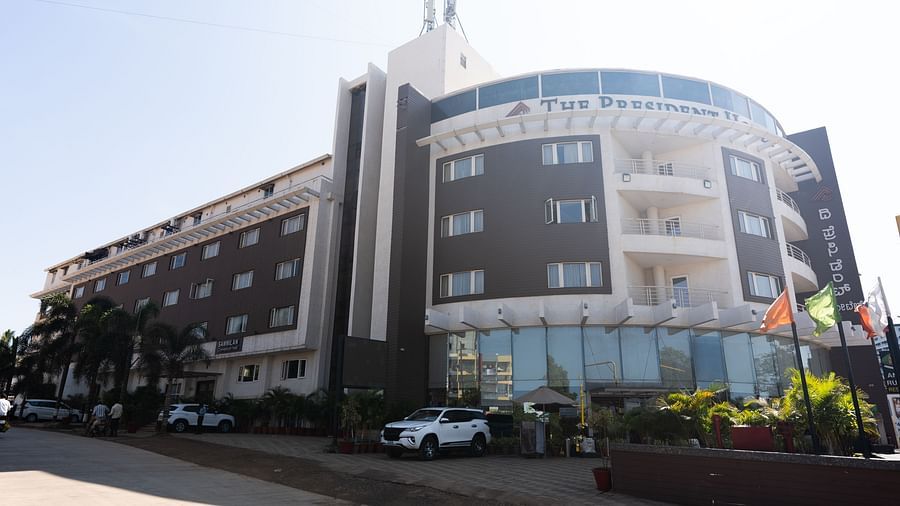 An image of a facade of The President Hotel, Hubli