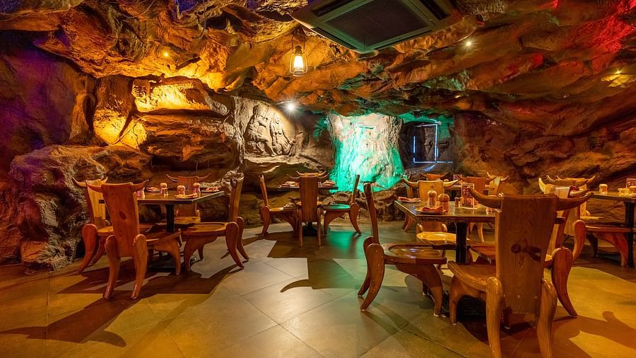 Seating arrangements inside the cave themed gufha restaurant at The President Hotel