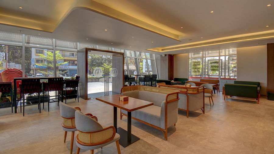 Over view of two sister's cafe The SSK Solitaire Boutique Hotel & Spa, Gangapur Road - Nashik featuring tables and chairs.