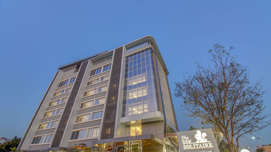 Low angle shot of Facade of  The SSK Solitaire Boutique Hotel & Spa, Gangapur Road - Nashik with backdrop of blue sky
