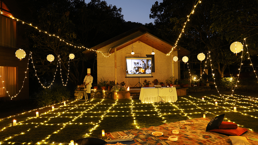 A lavish movie night set up at night at The Sylvan Retreat, Dehradun.