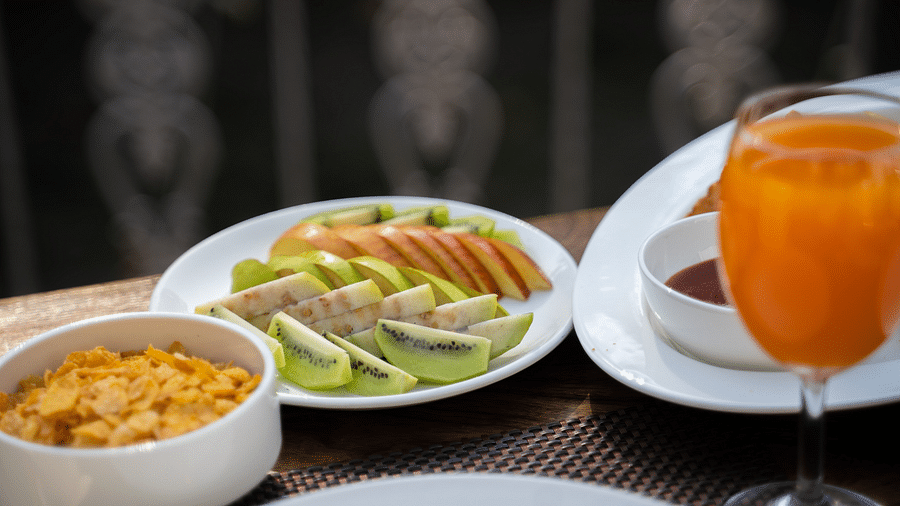 A close up shot of a drink placed along with various meals on the table at the Sylvan Retreat, Dehradun.