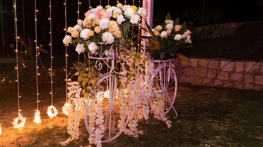 Lavish setup of a flowers with lights in the background at night at The Sylvan Retreat, Dehradun.