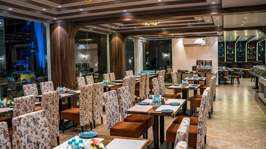 seating arrangements inside the in-house restaurant - The Tanisi Hotels & Resorts, Goa