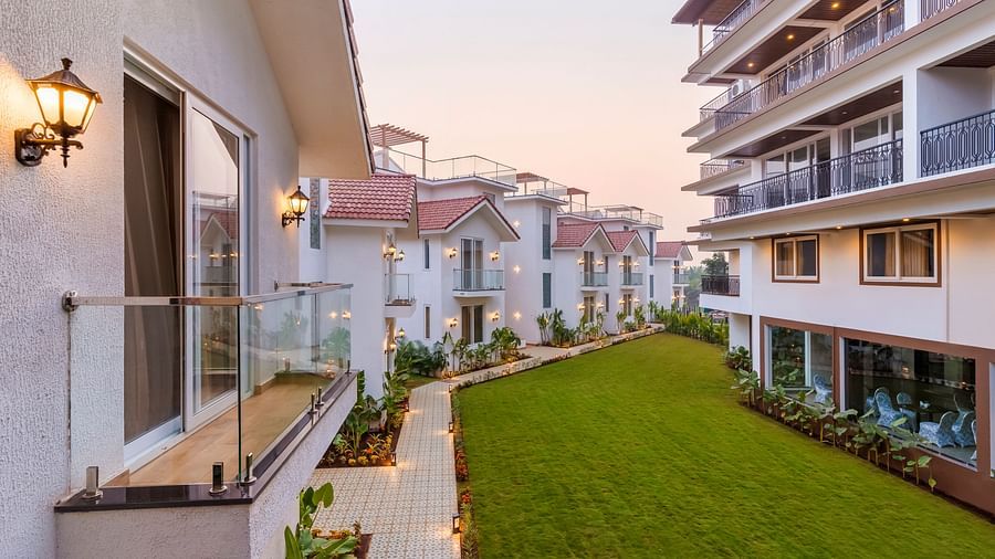 Rooms view with a manicured garden in front of it - The Tanisi Hotels & Resorts, Goa