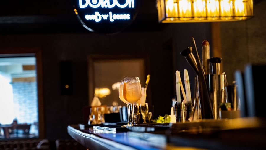 image of the bar counter top with various bar essentials at the bourbon club and lounge - The Tattva Boutique Resort