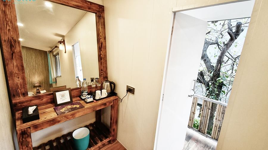 close up image of the dressing table with a square shaped mirror in the deluxe room - The Tattva Boutique Resort
