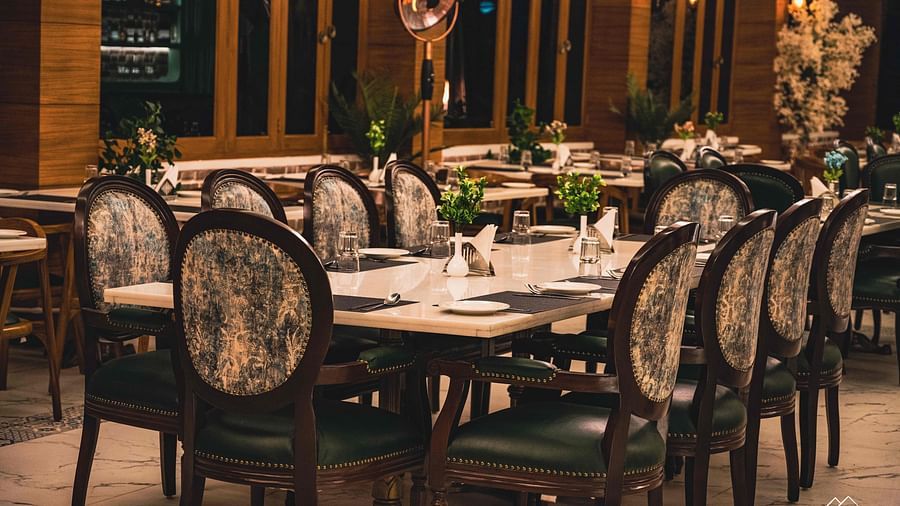 image of the alpenrose restaurant featuring an elegant dining table with well placed cutlery - the tattva boutique resort