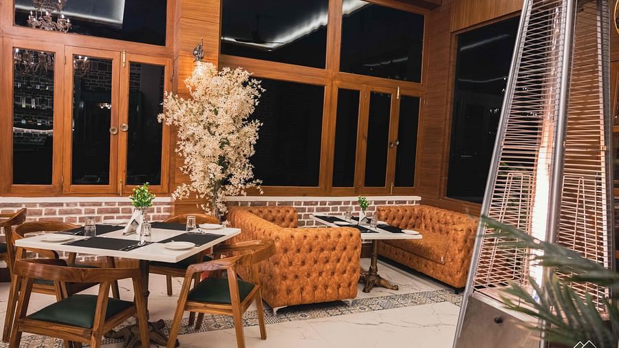 image of the indoor dining space of the alpenrose restaurant - the tattva boutique resort