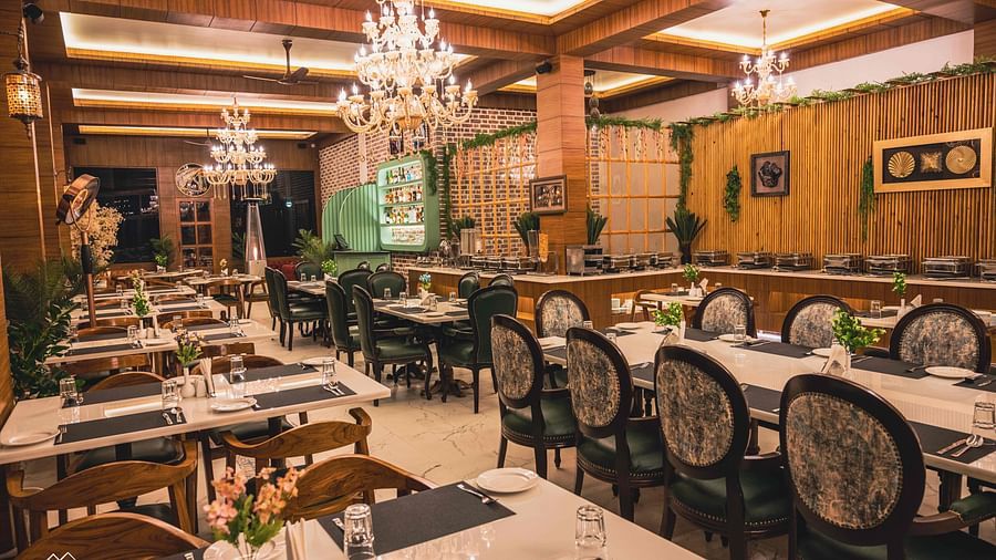 image of the alpenrose restaurant with well arranged dining area with elegant chairs - the tattva boutique resort