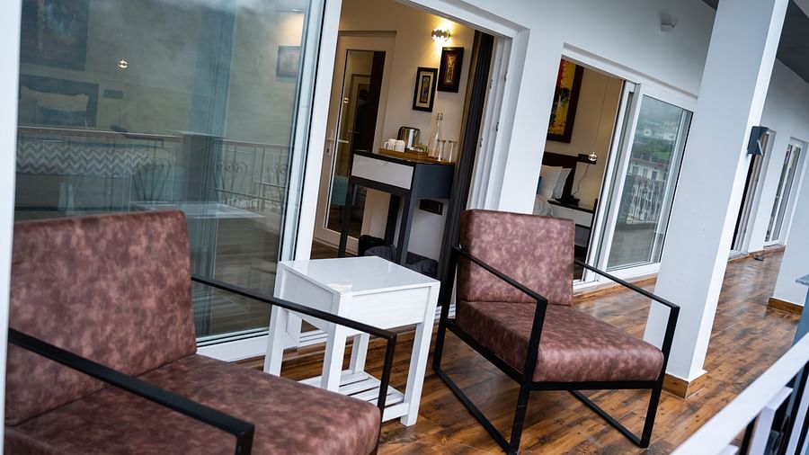 image of the outdoor seating area in the balcony of the pent house - The Tattva Boutique Resort
