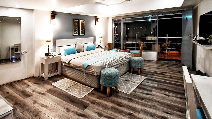 corner view image of  the premium room during the night with modern interiors - The Tattva Boutique Resort