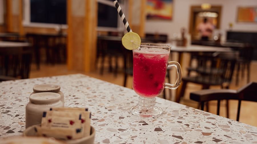 Shot of a drink kept on the table of the restaurant | The Tattva Devprayag