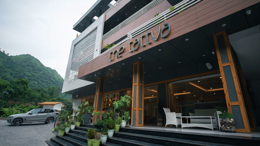 Facade of The Tattva Devaprayag featuring the entrance and parking space.