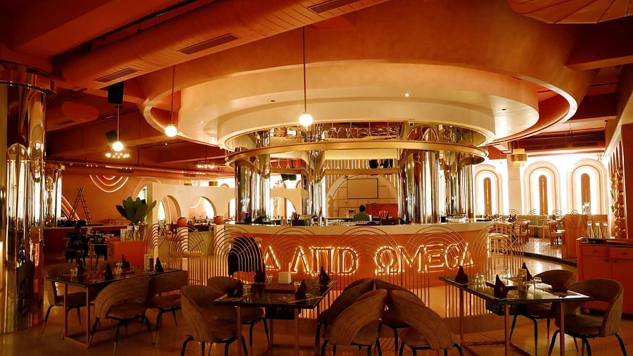An image of a restaurant featuring a counter, and tables and chairs set at Themis Barbecue House, Ambala