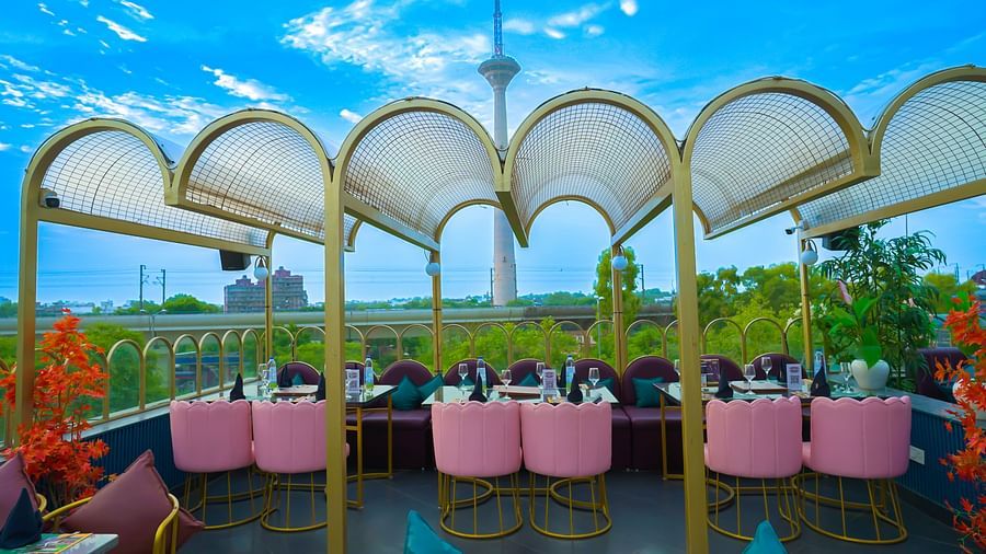 An image of a restaurant in the terrace with chairs and tables - Themis Barbecue House, NSP Pitampura