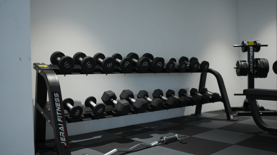 tiers of dumbbells arranged on a heavy duty storage rack inside a gym at Tiara by MPS.