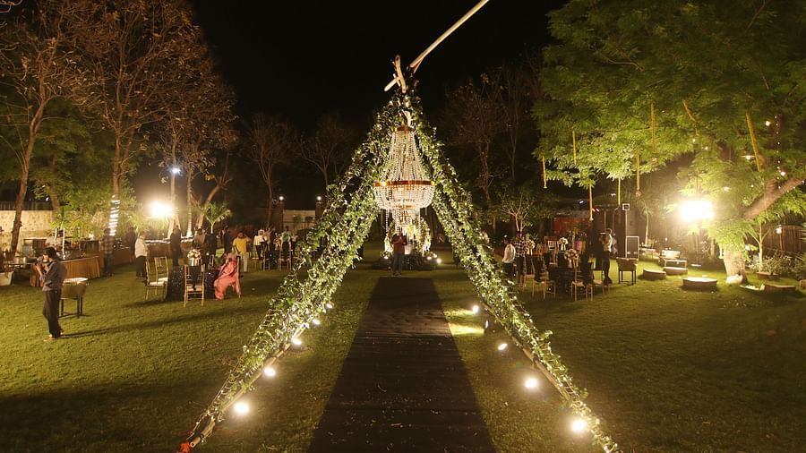 Lawn decorated with lights and canopy setup for a night event at Tisya Farms, Gurgaon.