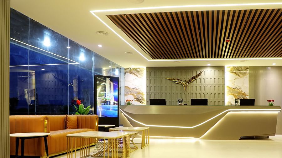 Lobby lounge at Town Square Suites with comfortable seating and sleek modern interiors
