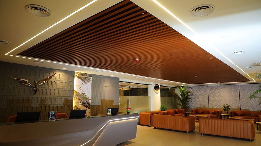 Spacious and stylish reception area at Town Square Suites with contemporary ceiling design