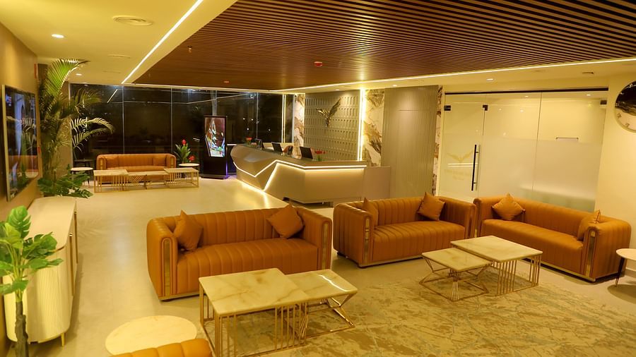 Cosy guest lounge at Town Square Suites featuring comfortable sofas and warm ambient lighting