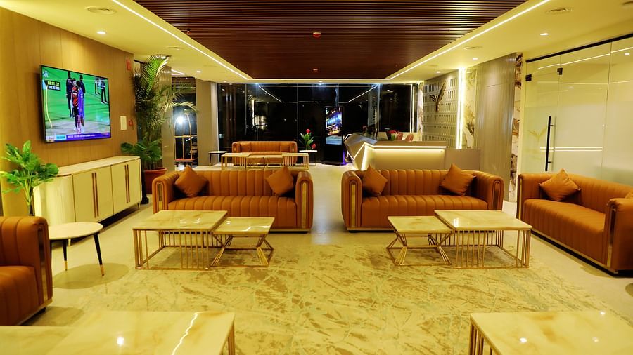 Chic lobby lounge at Town Square Suites with plush seating and a sophisticated ambiance