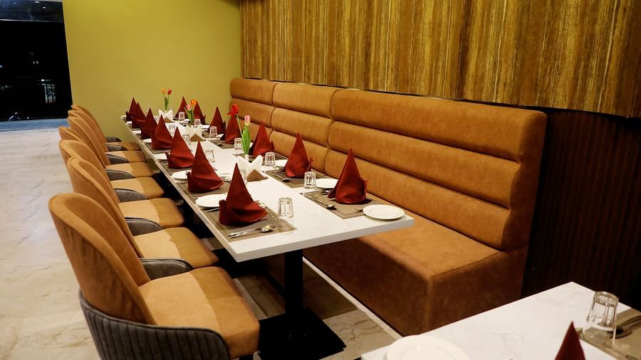 Private dining booths at Town Square Suites restaurant with intimate seating and elegant decor