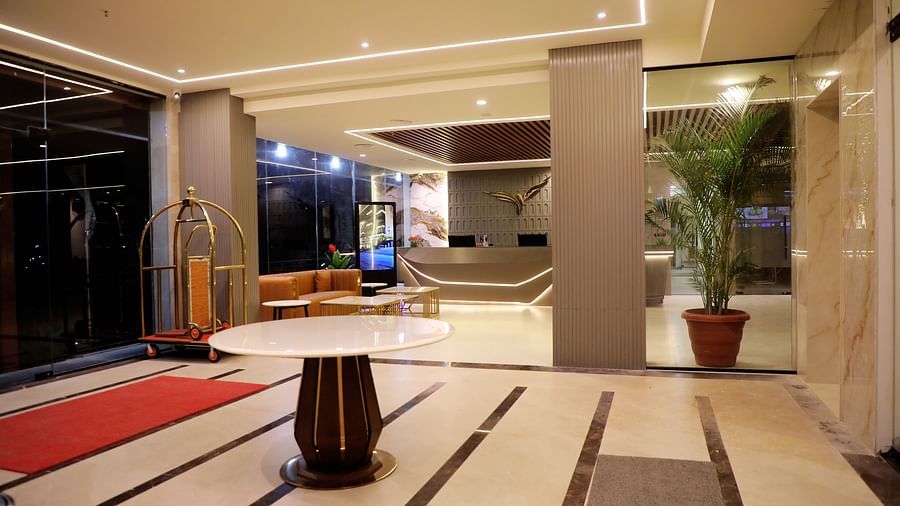 Grand hotel entrance at Town Square Suites with modern architectural design and stylish decor