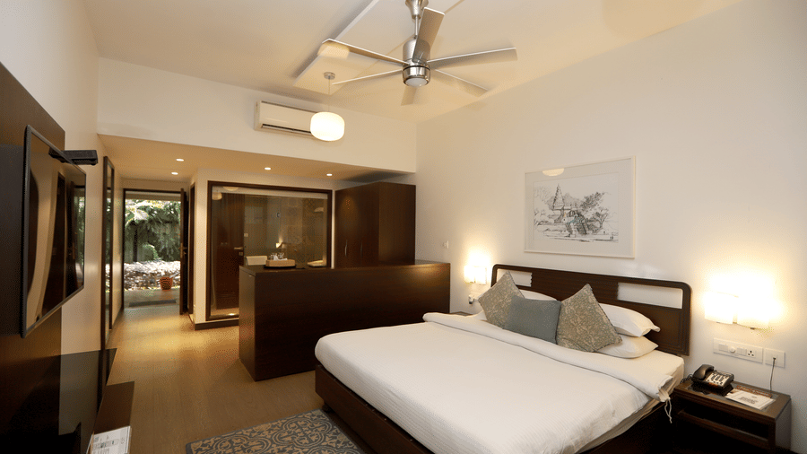A comprehensive look at the room's flow, from the sleeping area to the open-concept bathroom and hallway | Trance Sunderban Resort