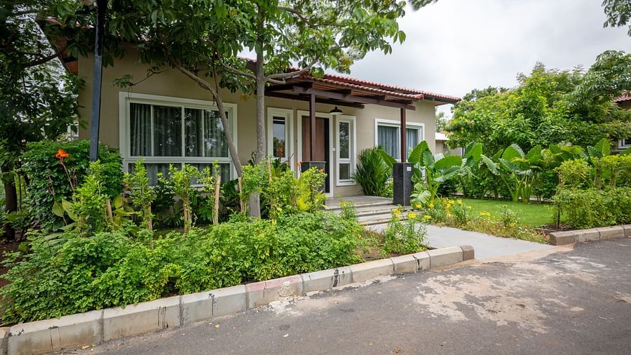 Front view of Ananta Villa – 3-Bedroom Villa at Trance Veechika Resort, Vikarabad, surrounded by a lush green landscape.