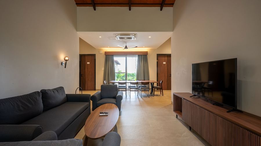 Elegant living area in Ananta Villa – 3-Bedroom Villa, Trance Veechika Resort, Vikarabad, with cosy seating and a television unit.