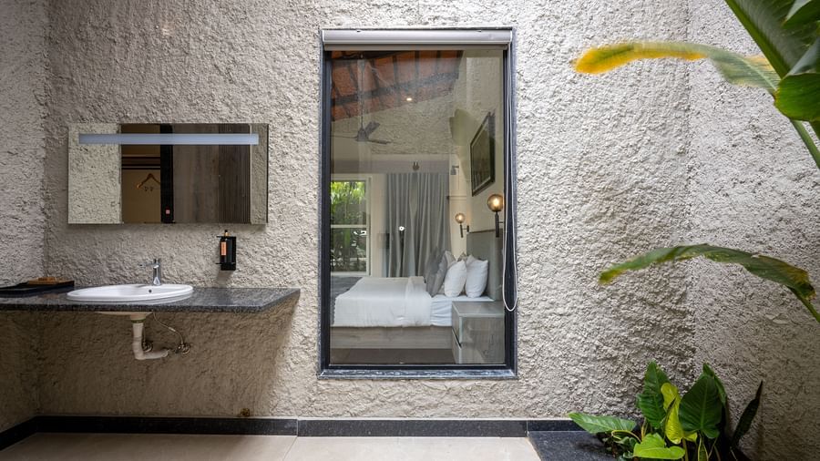 Stylish bathroom in Ananta Pool Villa – 5-Bedroom Pool Villa at Trance Veechika Resort, featuring greenery and modern design.