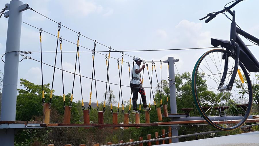 An image of a man crossing the rope obstacle course - Trance Veechika Resort