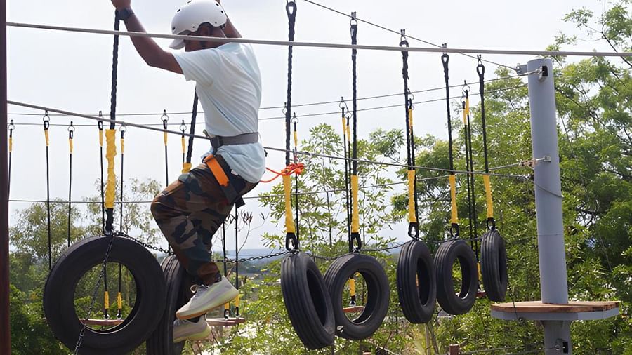 An image of a man crossing the rope obstacle course - Trance Veechika Resort