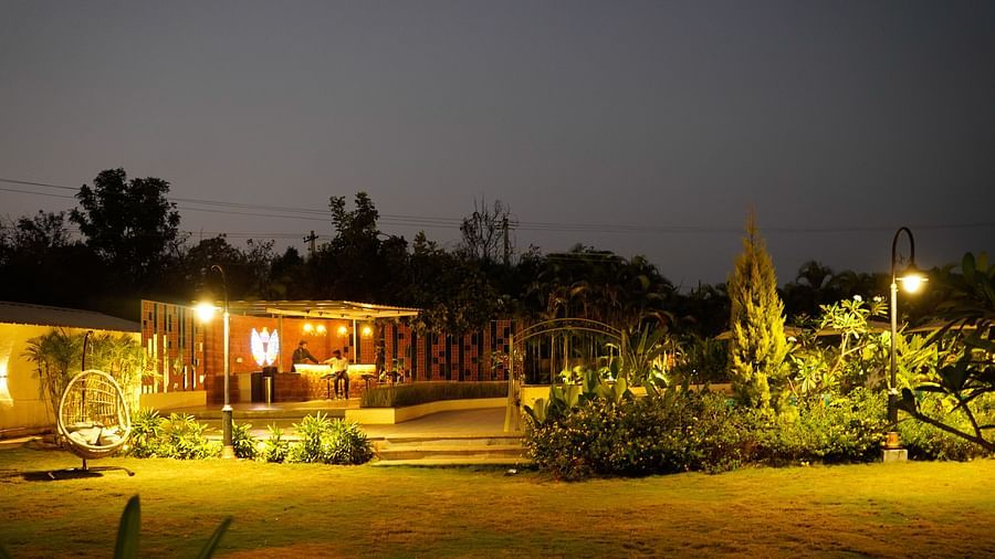 An image of the common area with bright lighting and greenery - Trance Veechika Resort