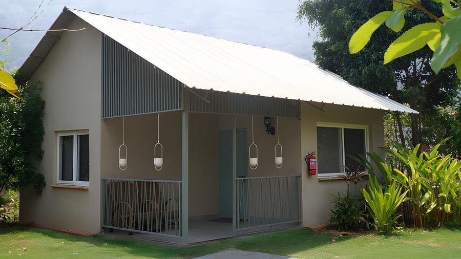 A facade image of the Hansa cottage with greenery around - Trance Veechika Resort