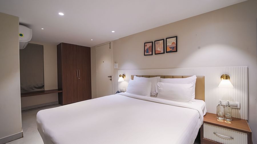 An image of a room with king size bed, bed side tables, lamps - Trance Veechika Resort, Vikarabad