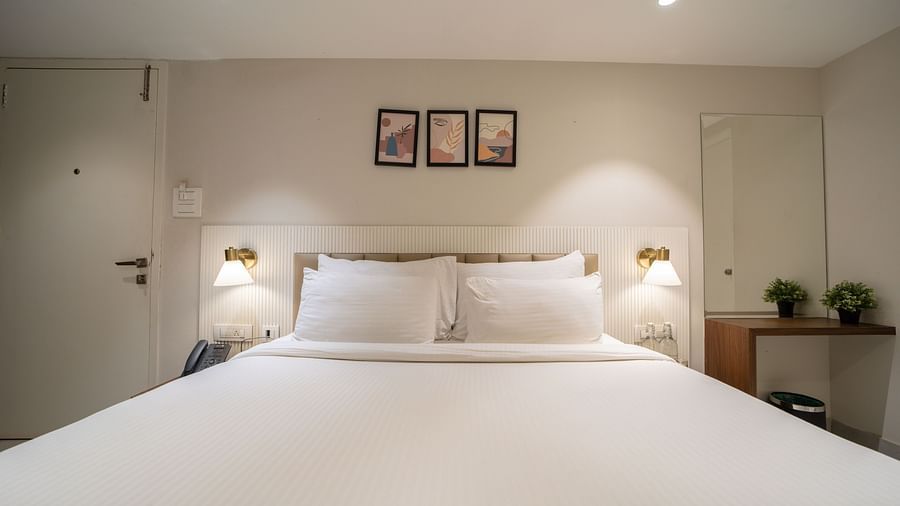 An image of a room with king size bed, bed side tables, lamps - Trance Veechika Resort, Vikarabad