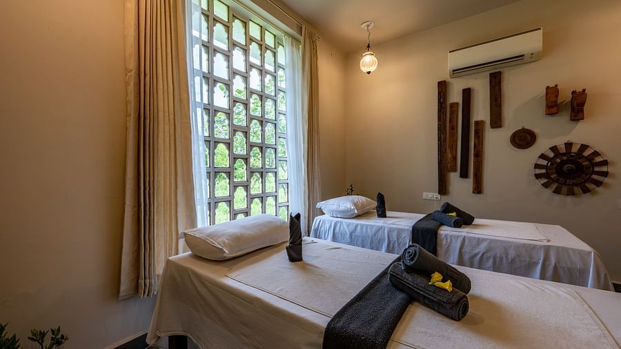 A close up shot of the bed with towels placed on them in our spa - Utsav Camp
