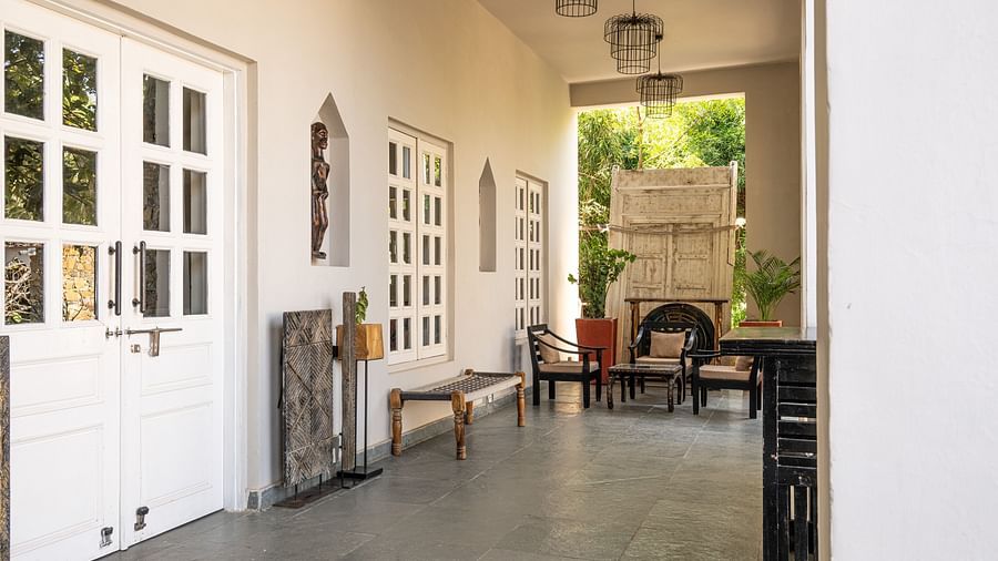 A corridor area with large white walls - Utsav Camp