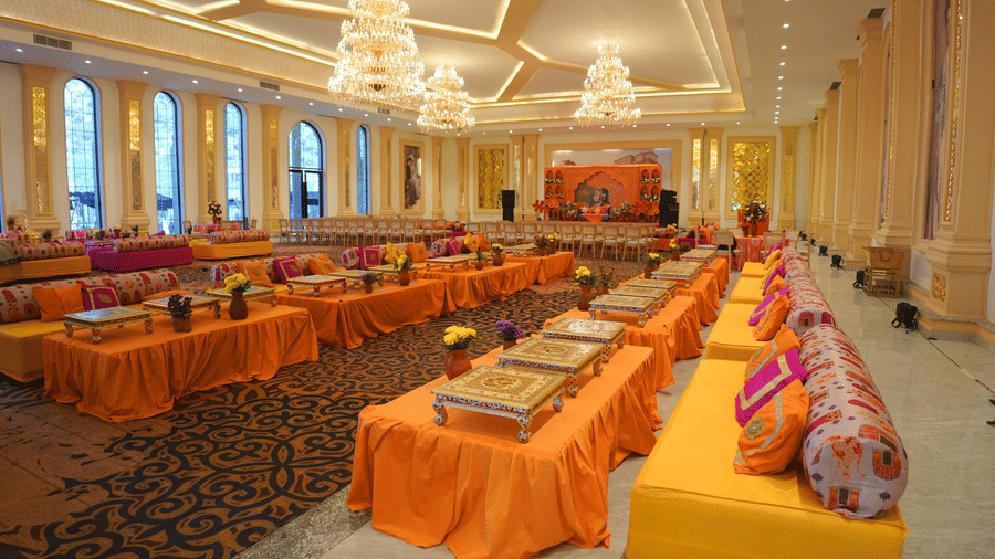 Cushioned floor seating arranged for a celebration at Valley by Grassfield, a wedding venue in Jaipur.