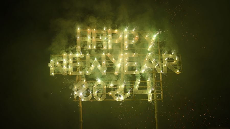 A  sign 'HAPPY NEW YEAR 2024' against a dark background, creating a festive display | Vedic Village Spa Resort, Kolkata