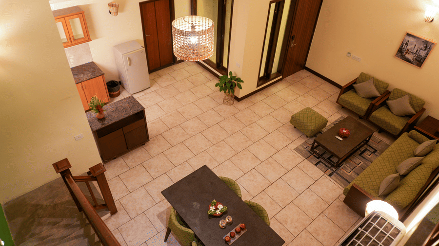 Spacious living area with comfortable seating in the luxury suite at the resort.