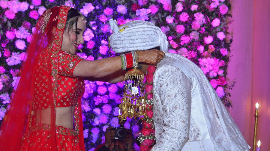 Bride and groom exchange garlands during a traditional ceremony at Vedikant Resorts The Mallard Corbett.