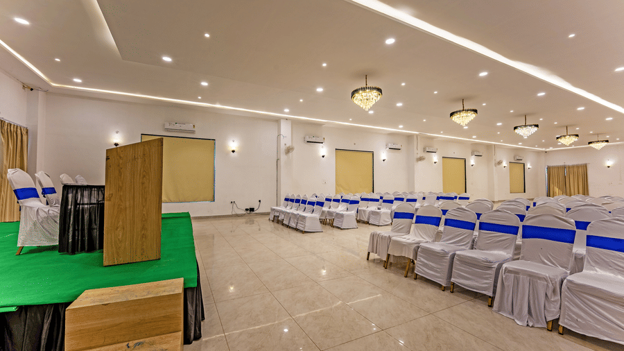 Mystic Jungle Hall at Vedikant Resorts The Mallard Corbett featuring a conference style setup featuring a stage with panel for four people, a podium, and a seating arrangement for the huge crowd.