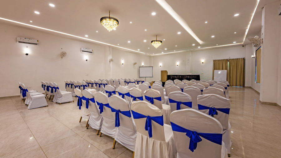 Mystic Jungle Hall at Vedikant Resorts The Mallard Corbett featuring a number of chairs in a conference setting. The space also has chandeliers, ceiling lights, panels, podiums, AC, fans, etc.