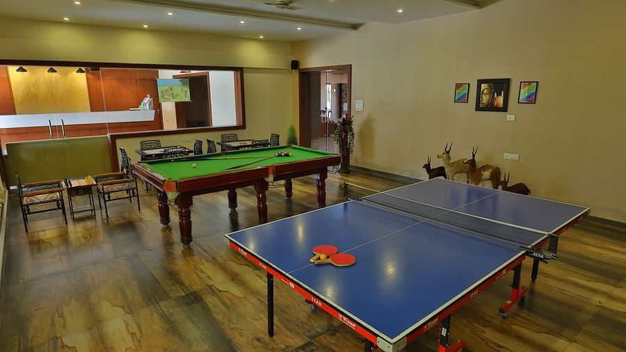Games room with a pool table, table tennis table, and chairs - Vishal Lords Inn Gir Forest
