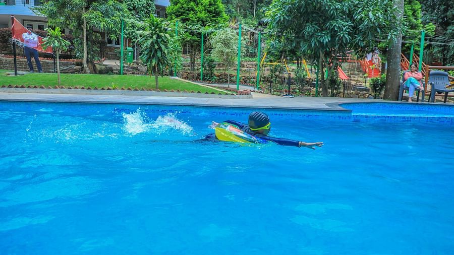 Image of a person swimming in the pool at WOW Bison Woods.