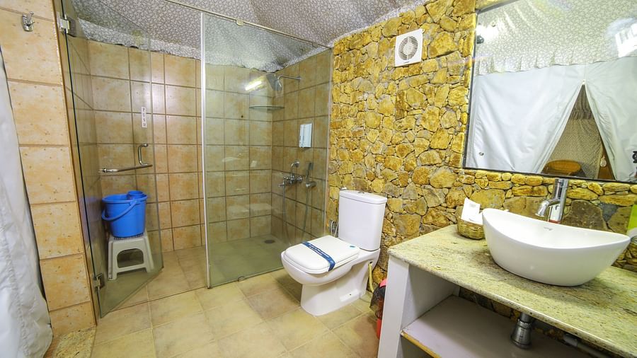 Image of a washroom with a sink and a separate shower cubicle at WOW Bison Woods.
