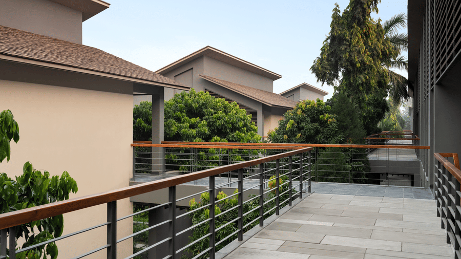 Private balcony corridor with garden views at Wyndham Garden.